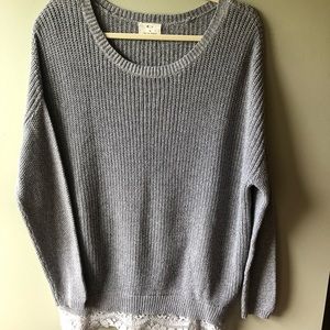 Women’s gray sweater.